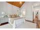Bedroom with wood ceiling, hard wood floor and white furniture at 4952 Steeplechase Ln, Hollywood, SC 29449