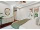 Bedroom featuring white bed, hardwood floors and view to a beautiful backyard at 4952 Steeplechase Ln, Hollywood, SC 29449