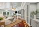 Bright bedroom with a seating area, entertainment center, and patio access at 4952 Steeplechase Ln, Hollywood, SC 29449