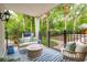 Inviting outdoor space featuring outdoor seating, palm trees, and a fenced yard for relaxing and entertaining at 4952 Steeplechase Ln, Hollywood, SC 29449