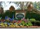 Beautiful entrance to The Plantation At Stono Ferry, featuring colorful flowers and mature landscaping at 4952 Steeplechase Ln, Hollywood, SC 29449