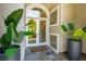 Welcoming front entrance featuring double doors, stylish plants, and unique glass block accents at 4952 Steeplechase Ln, Hollywood, SC 29449