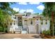 Stunning two-story home with a grand entrance, arched windows, and lush landscaping at 4952 Steeplechase Ln, Hollywood, SC 29449