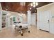 Spacious game room with custom wood ceiling, tile flooring, and white trim at 4952 Steeplechase Ln, Hollywood, SC 29449