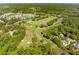 Aerial view of the meticulously maintained golf course surrounded by lush greenery and homes at 4952 Steeplechase Ln, Hollywood, SC 29449
