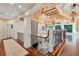 Open hallway with wood ceilings, stone fireplace, and decorative iron railings at 4952 Steeplechase Ln, Hollywood, SC 29449