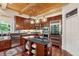 Gourmet kitchen featuring custom cabinets, stainless steel appliances and a granite island at 4952 Steeplechase Ln, Hollywood, SC 29449