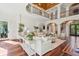 Bright, open living room with hardwood floors and wrought iron balcony overlooking the spacious seating area at 4952 Steeplechase Ln, Hollywood, SC 29449