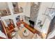 High-angle view of living room with stone fireplace and multiple seating areas at 4952 Steeplechase Ln, Hollywood, SC 29449