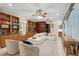 Open concept living area with comfortable seating and built-in bookshelves at 4952 Steeplechase Ln, Hollywood, SC 29449