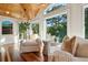 Bright living room with white furniture, vaulted ceilings, and lots of natural light at 4952 Steeplechase Ln, Hollywood, SC 29449