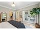 Comfortable main bedroom with ensuite and access to outdoor seating area at 4952 Steeplechase Ln, Hollywood, SC 29449