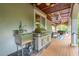 Outdoor sink and grilling area off covered patio at 4952 Steeplechase Ln, Hollywood, SC 29449