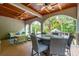Covered patio area with dining and lounge seating with great ceiling fans at 4952 Steeplechase Ln, Hollywood, SC 29449