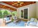 Covered patio area with dining and lounge seating at 4952 Steeplechase Ln, Hollywood, SC 29449