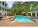 Backyard with a beautiful pool, lounge chairs, Tiki Bar, and covered seating, great for outdoor enjoyment at 4952 Steeplechase Ln, Hollywood, SC 29449