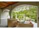 Inviting outdoor porch with comfortable seating and scenic views of the surrounding greenery at 4952 Steeplechase Ln, Hollywood, SC 29449