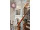 Grand staircase featuring iron railings, wood steps, and a decorative chandelier at 4952 Steeplechase Ln, Hollywood, SC 29449