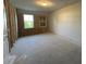Unfinished basement with dual windows, offering a blank canvas to customize the space to your needs at 5114 Double Eagle Loop, Summerville, SC 29485