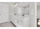 Elegant bathroom with double vanity, quartz countertop, framed mirror, and tiled flooring, a spa-like retreat at 5114 Double Eagle Loop, Summerville, SC 29485