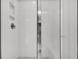 White tiled shower with a glass door and modern fixtures offering a clean and modern design at 5114 Double Eagle Loop, Summerville, SC 29485