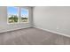 Bedroom featuring plush carpeting and large window views, creating a serene and inviting atmosphere at 5114 Double Eagle Loop, Summerville, SC 29485