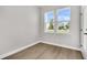 Modern bedroom with laminate flooring and double windows, creating a light-filled and inviting space at 5114 Double Eagle Loop, Summerville, SC 29485
