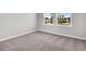 Cozy bedroom with plush carpeting, a double window providing neighborhood views and ample natural light at 5114 Double Eagle Loop, Summerville, SC 29485