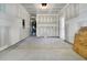 Unfinished two car garage with water heater and door leading outside at 5114 Double Eagle Loop, Summerville, SC 29485