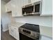 Modern kitchen with stainless steel appliances, white cabinets, and sleek countertops at 5114 Double Eagle Loop, Summerville, SC 29485