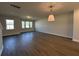 Spacious living room with hardwood floors, large windows, and ample natural light at 5114 Double Eagle Loop, Summerville, SC 29485