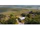 Stunning aerial view of a lowcountry home near marshland and waterway at 561 Seaward Dr, Charleston, SC 29412