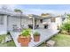 Spacious back deck area with patio furniture, an umbrella, and a gas grill at 561 Seaward Dr, Charleston, SC 29412