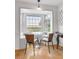 Cozy dining nook with bay window seating and serene outdoor views, ideal for enjoying meals at 561 Seaward Dr, Charleston, SC 29412