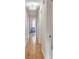 Hallway with hardwood floors and blue chair in the background at 561 Seaward Dr, Charleston, SC 29412
