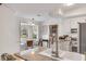 Bright kitchen featuring granite counters, white cabinets, stainless steel appliances, and breakfast nook with window views at 561 Seaward Dr, Charleston, SC 29412