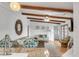 Stylish living space with wood beams, adjacent to a modern kitchen and comfortable seating arrangements at 561 Seaward Dr, Charleston, SC 29412