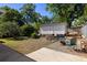 Backyard with shed, patio area, and mature trees creating a private retreat at 5907 Murray Dr, Hanahan, SC 29410