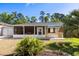 Spacious backyard featuring a well-maintained lawn and colorful patio at 5907 Murray Dr, Hanahan, SC 29410