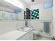Bright bathroom featuring a white sink, toilet, with colorful prints, and tiled floor at 5907 Murray Dr, Hanahan, SC 29410