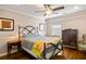 Comfortable bedroom with hardwood floors, large bed and accent furniture with a ceiling fan at 5907 Murray Dr, Hanahan, SC 29410