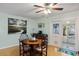 Cozy dining area with hardwood floors, natural light and access to the screened-in porch at 5907 Murray Dr, Hanahan, SC 29410