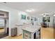 Open concept kitchen and dining area featuring an island with granite countertop at 5907 Murray Dr, Hanahan, SC 29410