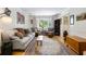Inviting living room showcasing hardwood floors, comfortable furniture, and a large window with natural light at 5907 Murray Dr, Hanahan, SC 29410