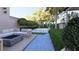 Private backyard with inground pool, cozy seating area and mature tropical landscaping at 66 Warren St # Main House Only, Charleston, SC 29403