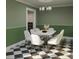 Dining room featuring modern chandelier, seating for six, and sleek green walls at 66 Warren St # Main House Only, Charleston, SC 29403