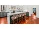 Open concept kitchen with marble island, breakfast bar seating, and stainless steel appliances at 66 Warren St # Main House Only, Charleston, SC 29403
