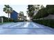 Lush backyard with a sparkling pool, manicured landscaping, and outdoor seating at 66 Warren St # Main House Only, Charleston, SC 29403