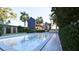 Inviting in-ground pool showcasing the home's architectural details and lush landscaping at 66 Warren St # Main House Only, Charleston, SC 29403