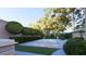 Stylish in-ground pool surrounded by lush greenery, providing a serene backyard oasis at 66 Warren St # Main House Only, Charleston, SC 29403